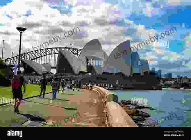 A Couple Enjoying A Scenic Walk Along Sydney's Coastline, With The Iconic Opera House In The Background Things To Do In Sydney For Free