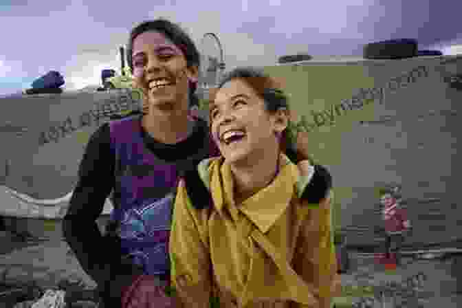 A Group Of Refugee Girls Smile And Laugh Together We Are Displaced: My Journey And Stories From Refugee Girls Around The World