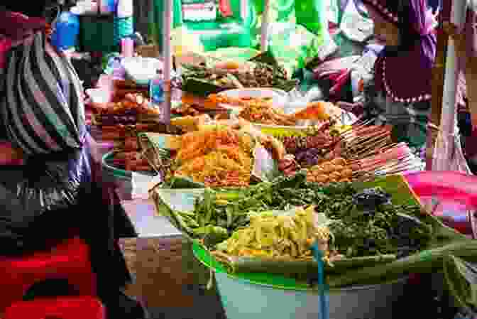 A Vendor Selling A Variety Of Indonesian Street Food Dishes, Including Satay, Gado Gado, And Nasi Goreng. Street Food Asia: Saigon Bangkok Kuala Lumpur Jakarta