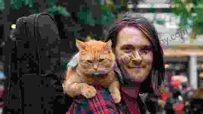 James Bowen, Author Of 'A Street Cat Named Bob,' Poses With His Beloved Feline Companion, Bob, A Stray Cat He Befriended On The Streets Of London. Cats Can Love Too