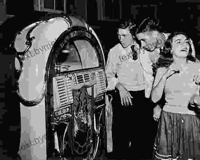 Teenagers Gathered Around A Jukebox In The 1950s Beatlemania: Technology Business And Teen Culture In Cold War America (Johns Hopkins Introductory Studies In The History Of Technology)